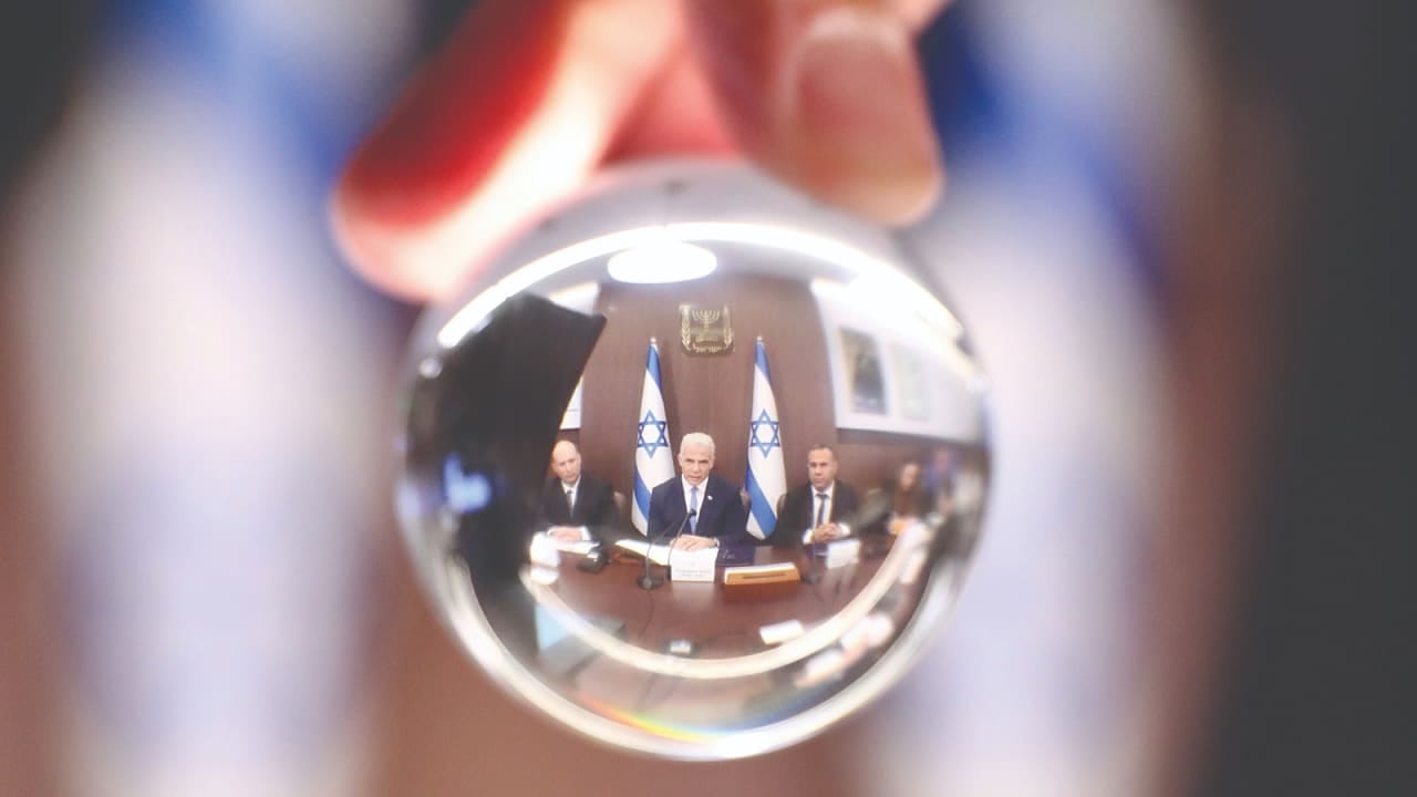 Bennett saw what Israelis wanted. He chose the opposite. Then-prime minister Yair Lapid with alternate prime minister Naftali Bennett at a government cabinet meeting in 2022.