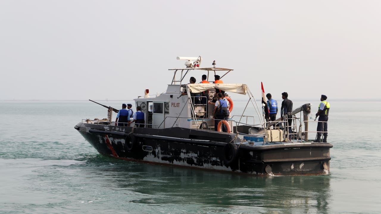 A Yemeni coast guard boat escorts a tugboat ferrying members of a Houthi delegation to attend a meeting of a committee overseeing a UN-led peace deal that will be held on board a UN-chartered ship off Yemen's port city of Hodeidah September 8, 2019.