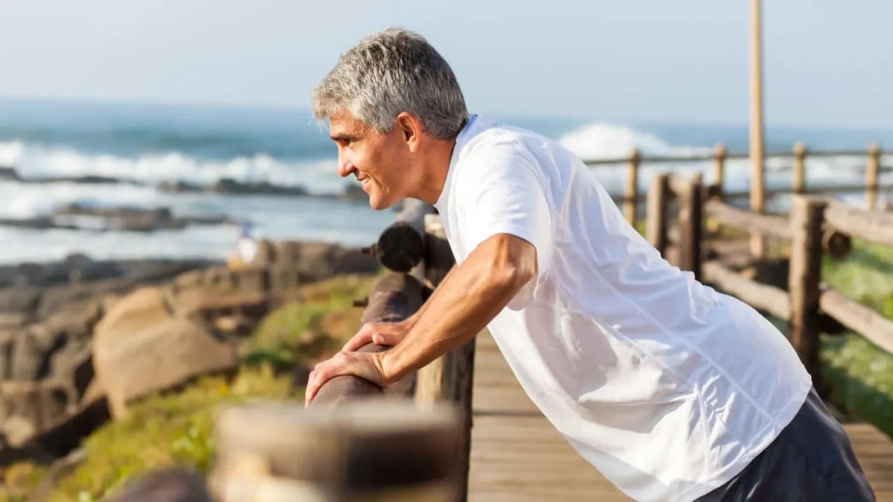 A man exercising on the seashore