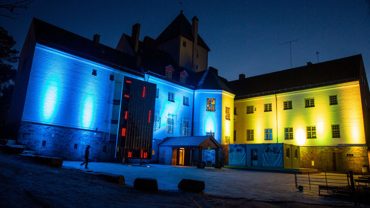 Picture taken on March 23, 2022 in Oslo shows the Holocaust Center on Bygdoy with it's building "Villa Grande" illuminated in the colors of Ukraine in support for the Ukrainian people.