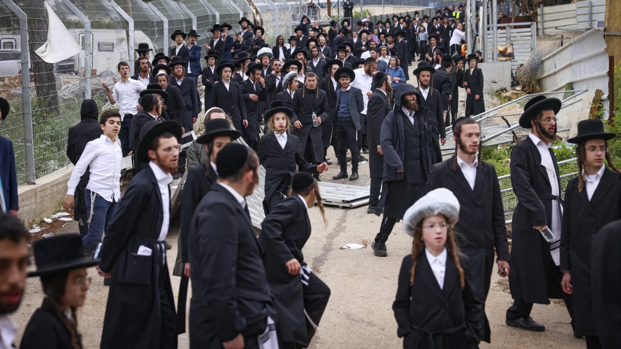 ULTRA-ORTHODOX JEWS walk through a forest near the grave of Rabbi Shimon Bar Yochai in Meron, northern Israel, attempting to reach the Lag BaOmer celebrations after the site was closed by police following Home Front Command restrictions, May 5, 2026.