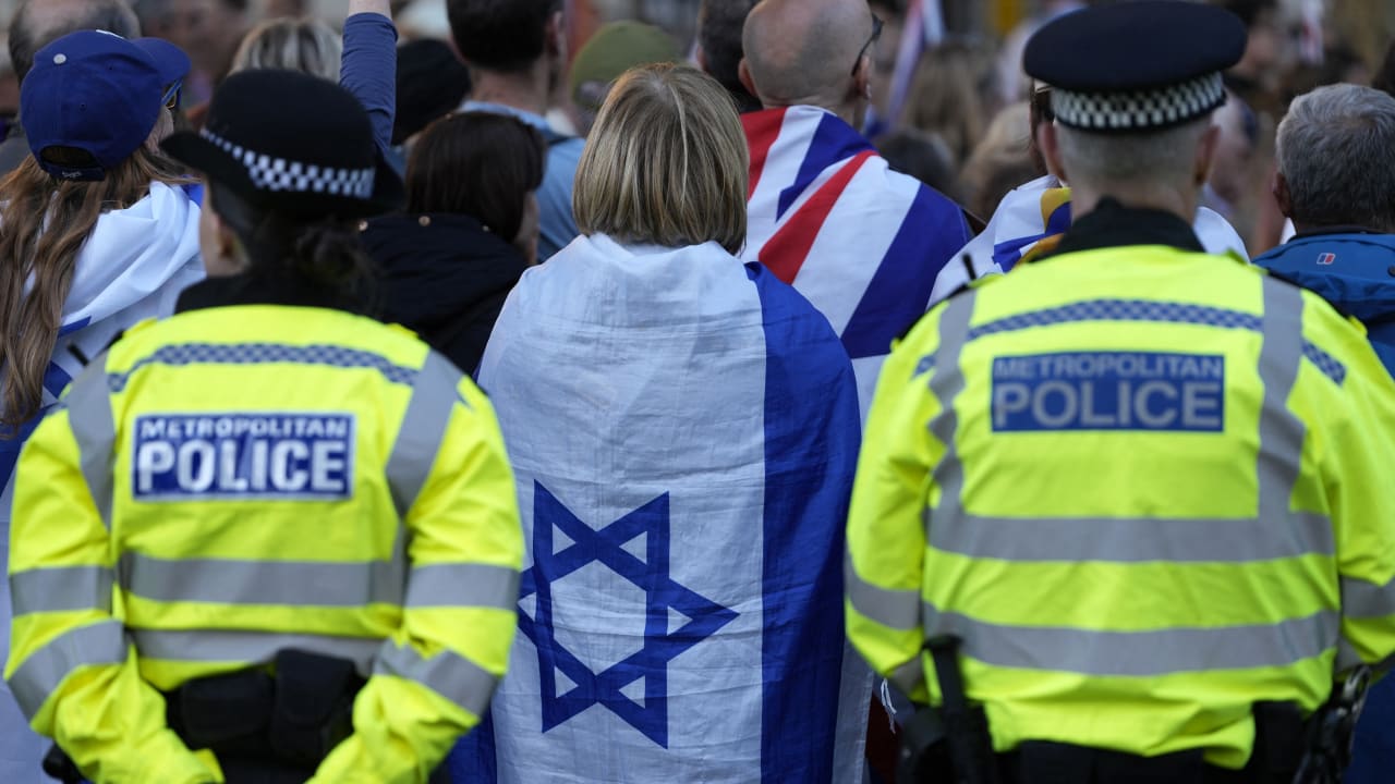 Metropolitan Police officers stand on duty as people attend a rally organised by the Campaign Against Antisemitism, opposite Downing Street in central London on April 30, 2026. (photo credit: CARLOS JASSO / AFP via Getty Images)