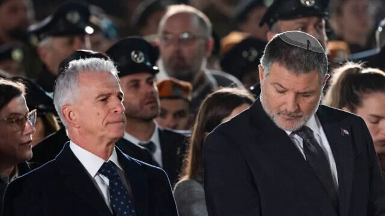 Mossad chief David Barnea (L) and Shin Bet chief David Zini at a Memorial Day ceremony at the Western Wall, in Jerusalem's Old City, April 20, 2026.