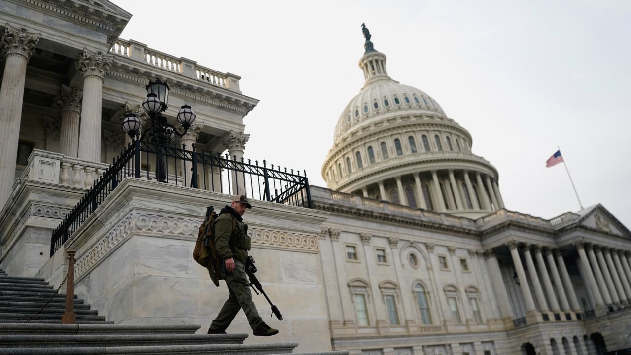 A member of the US Capitol police patrols following a vote in the US House of Representatives on a bipartisan war powers resolution aiming to stop Operation Epic Fury against Iran, on Capitol Hill, in Washington, DC, US, March 5, 2026.