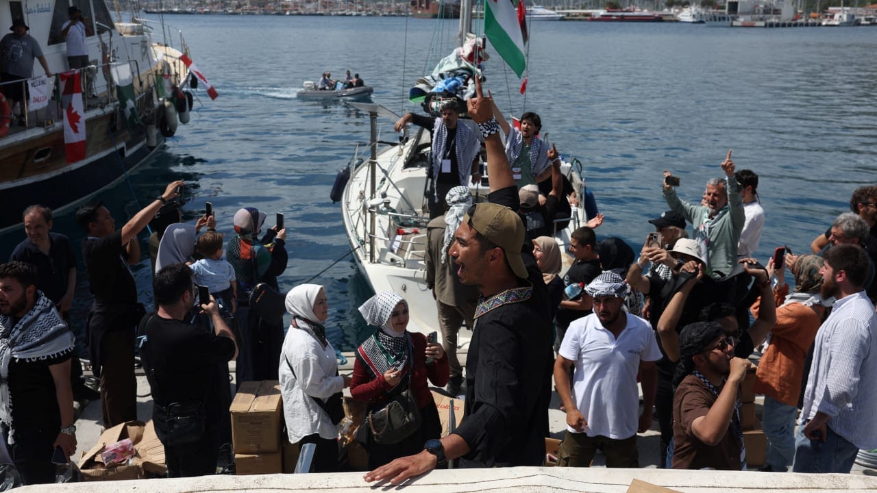 Activists greet as a boat taking part in the Global Sumud Flotilla, which aims to reach Gaza and break Israel’s naval blockade, departs from a port in the southern Turkish resort of Marmaris, Turkey, May 14, 2026. 