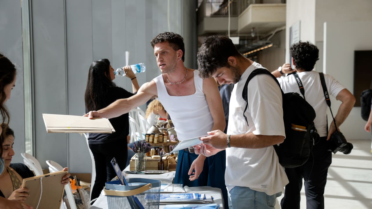 Visitors attend the “Batrei Zuzei” art fair featuring student works ahead of the Jewish holiday of Shavuot at Bezalel Academy of Arts and Design in Jerusalem, May 18, 2026.