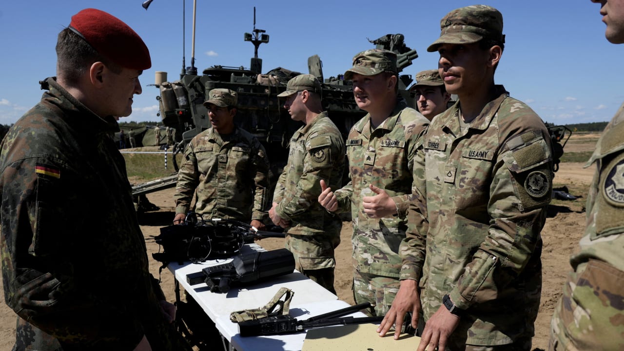 A German Army serviceman talks to US Army servicemen during NATO tests of the new counter-drone technologies in Pabrade training area, Lithuania May 15, 2026.
