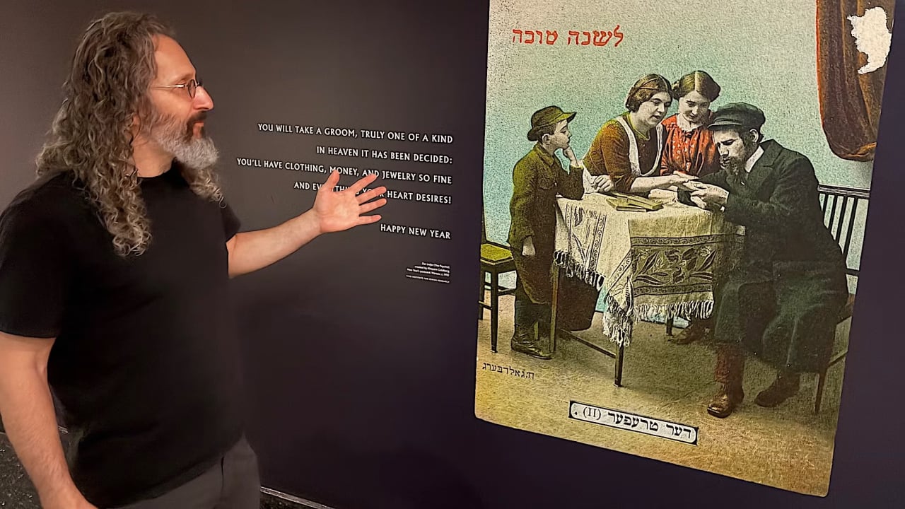 YIVO'S EDDY Portnoy, who curated the exhibit "Jews Are Magic," with a reproduction of a High Holiday card featuring a Jewish palm reader, Warsaw c. 1910.