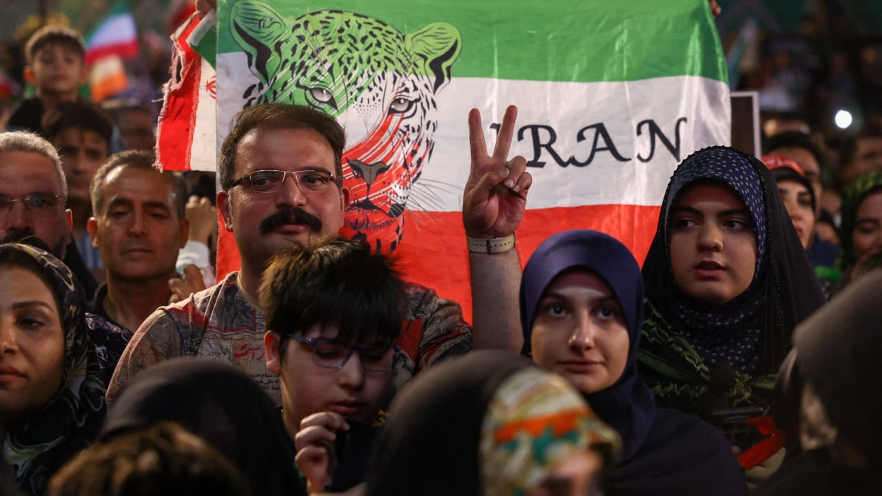 A MAN gestures as people gather at a farewell ceremony for Iran’s national soccer team ahead of their departure to the 2026 World Cup, in Tehran, in May 2026.
