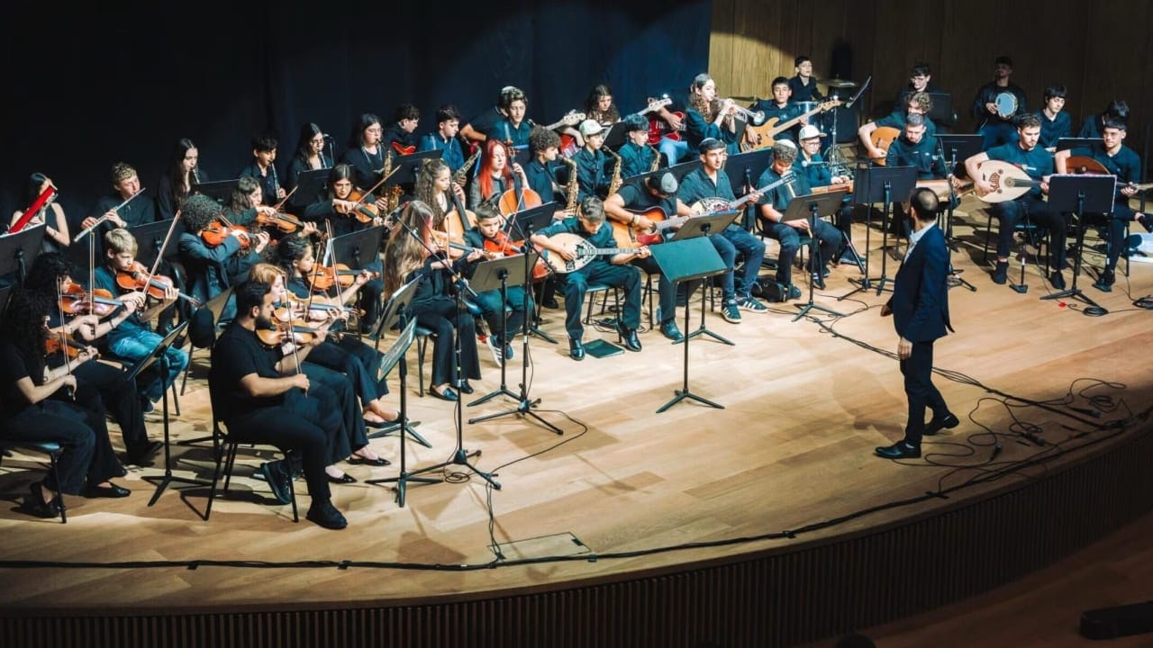 Tom Cohen conducts the youth program of The Jerusalem Orchestra East & West in Tel Aviv, May 2026.