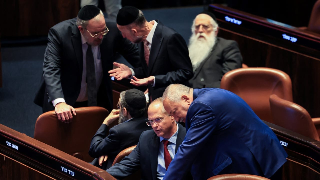 Israeli politicians react following a vote to dissolve the Knesset before the end of its term, in the Knesset, Israel's parliament in Jerusalem, May 20, 2026.