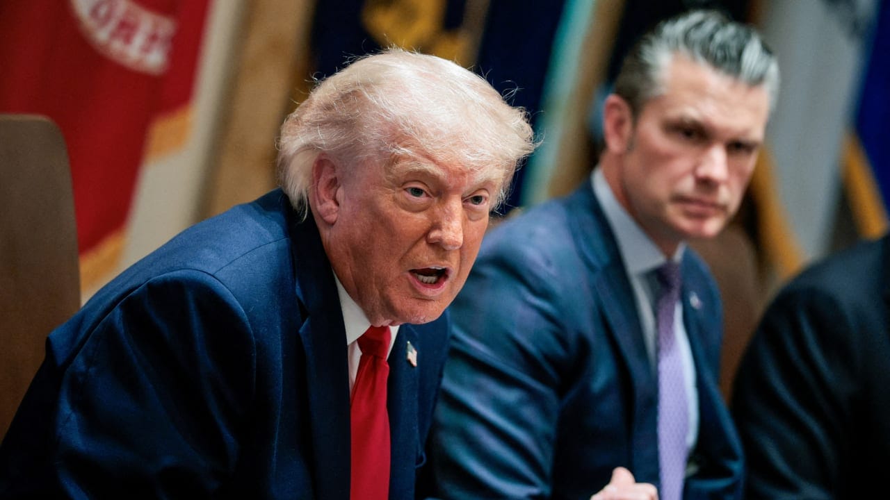 US President Donald Trump speaks next to Defense Secretary Pete Hegseth during a cabinet meeting in the Cabinet Room at the White House, in Washington.
