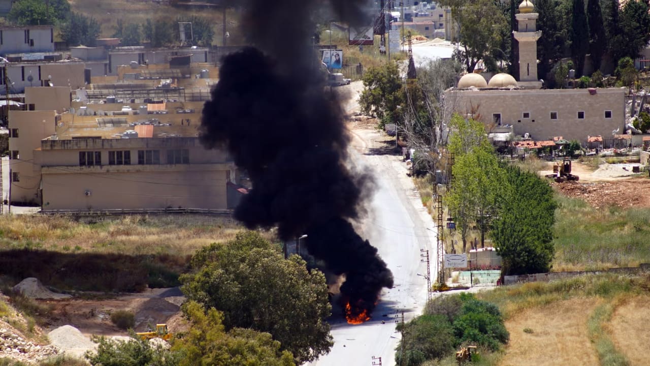 Smoke rises from a vehicle targeted by an Israeli drone attack in the southern Lebanese city of Nabatieh on June 5, 2026.
