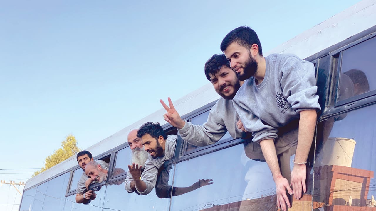 Palestinians released from Israeli prisons under a Gaza ceasefire and hostage exchange deal with Palestinian factions, arrive at the Nasser hospital in Khan Yunis in the southern Gaza Strip in October 2025. 