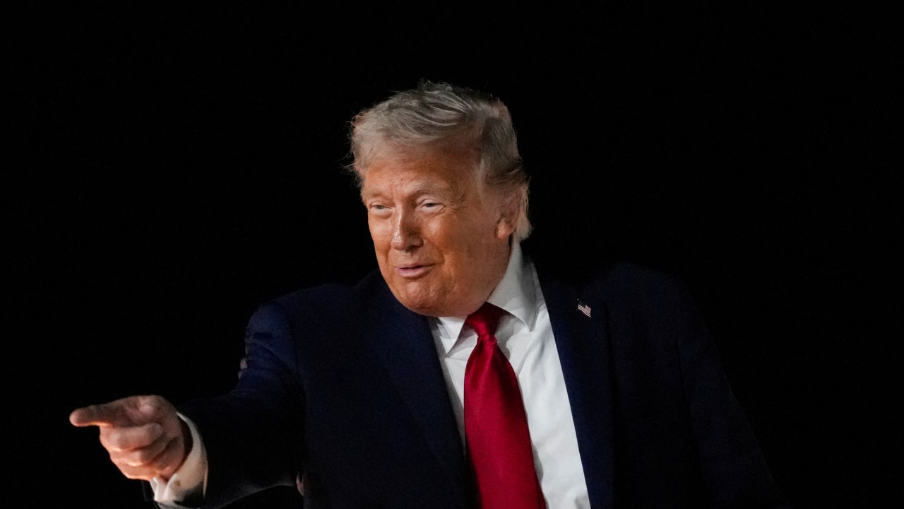 US President Donald Trump reacts as he boards Air Force One, after attending Game 3 of the NBA Finals, at John F. Kennedy International Airport in New York.