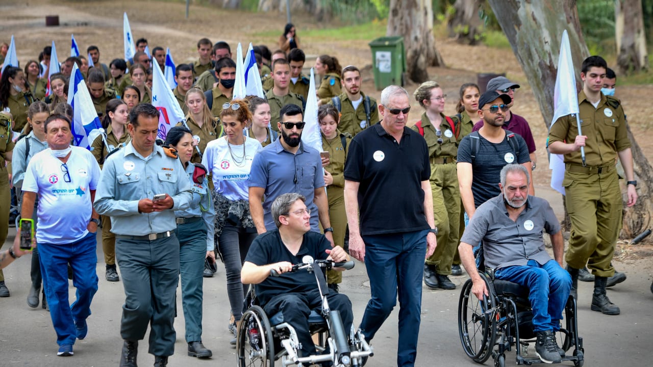 Israeli Minister of Defense Benny Gantz, Israeli soldiers and Israeli veterans and disabled IDF soldiers seen during a march honoring IDF wounded and disabled IDF, in Tel Aviv, November 17, 2021.
