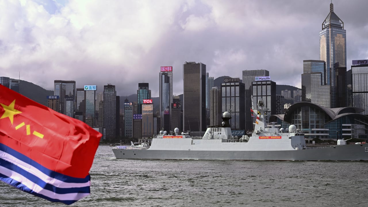 The Chinese People's Liberation Army (PLA) Navy frigate Hengyang (568) is seen past a PLA Navy ensign as it sails through Victoria Harbour during its arrival in Hong Kong for a five-day visit on July 2, 2026.