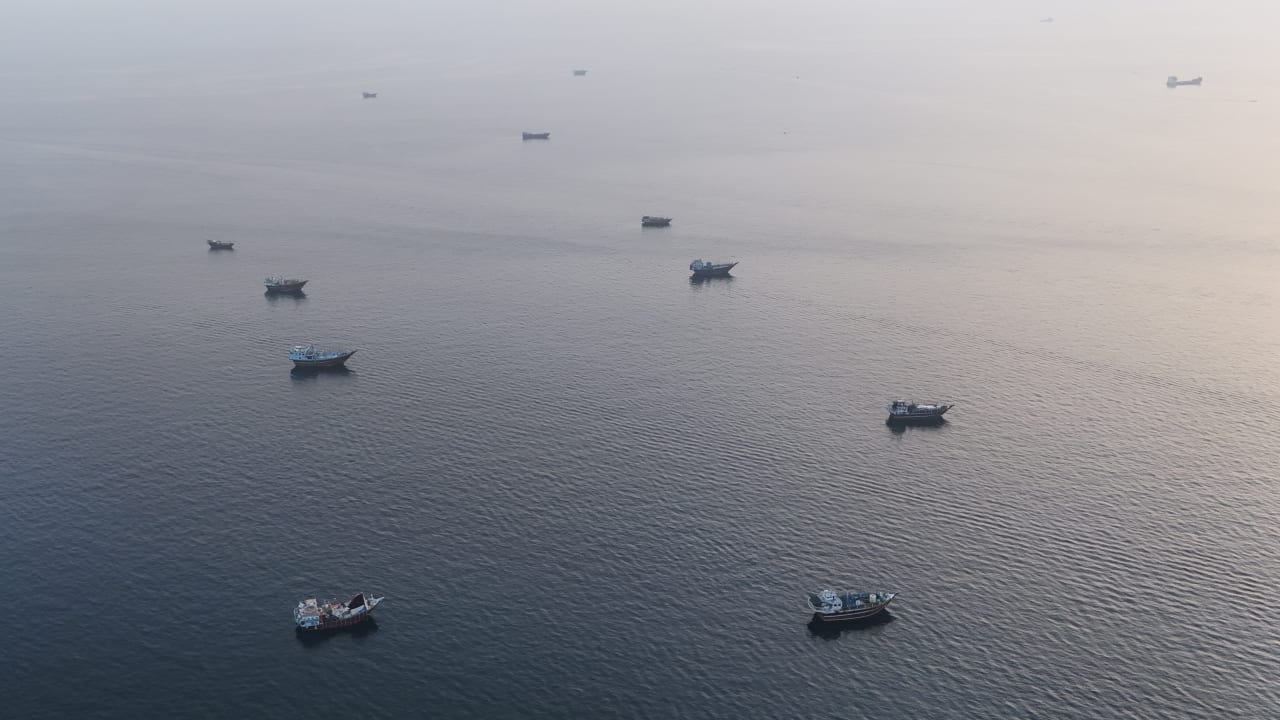 This aerial photograph shows boats anchored off Oman's northern Musandam Peninsula near the Strait of Hormuz on June 27, 2026.