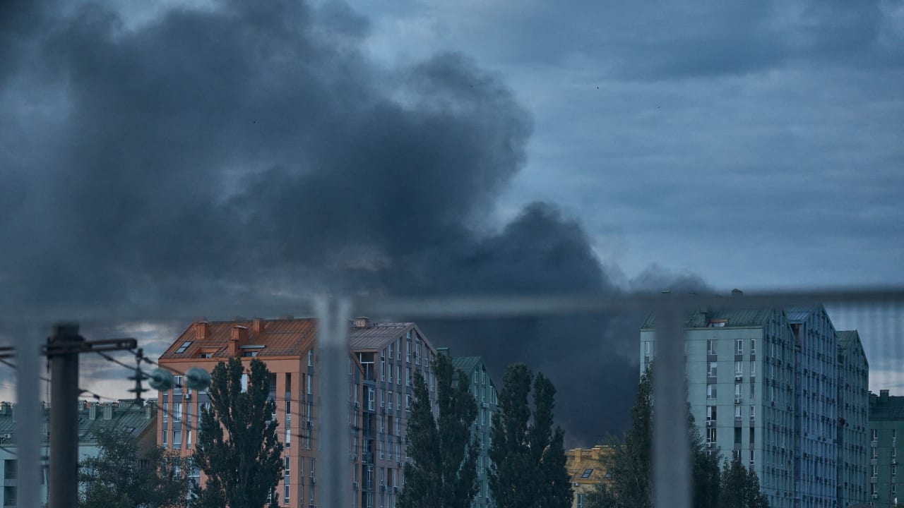 Smokes rises after a Russian ballistic missile strike hit a roadway in Kyiv's Darnytskyi district, where a traffic-light control electrical cabinet caught fire and windows were shattered in nearby residential buildings on July 11, 2026 in Kyiv, Ukraine.