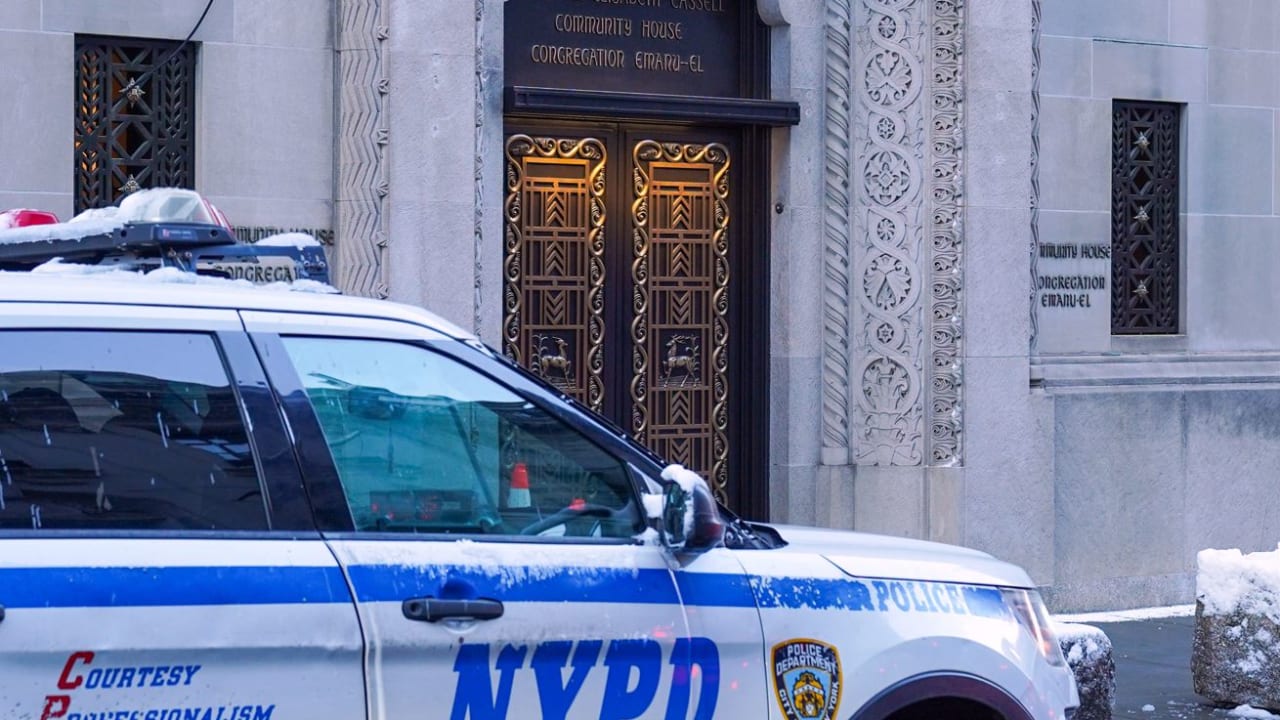 An NYPD vehicle is seen outside of the Congregation Temple Emanu-El in New York City in 2025.