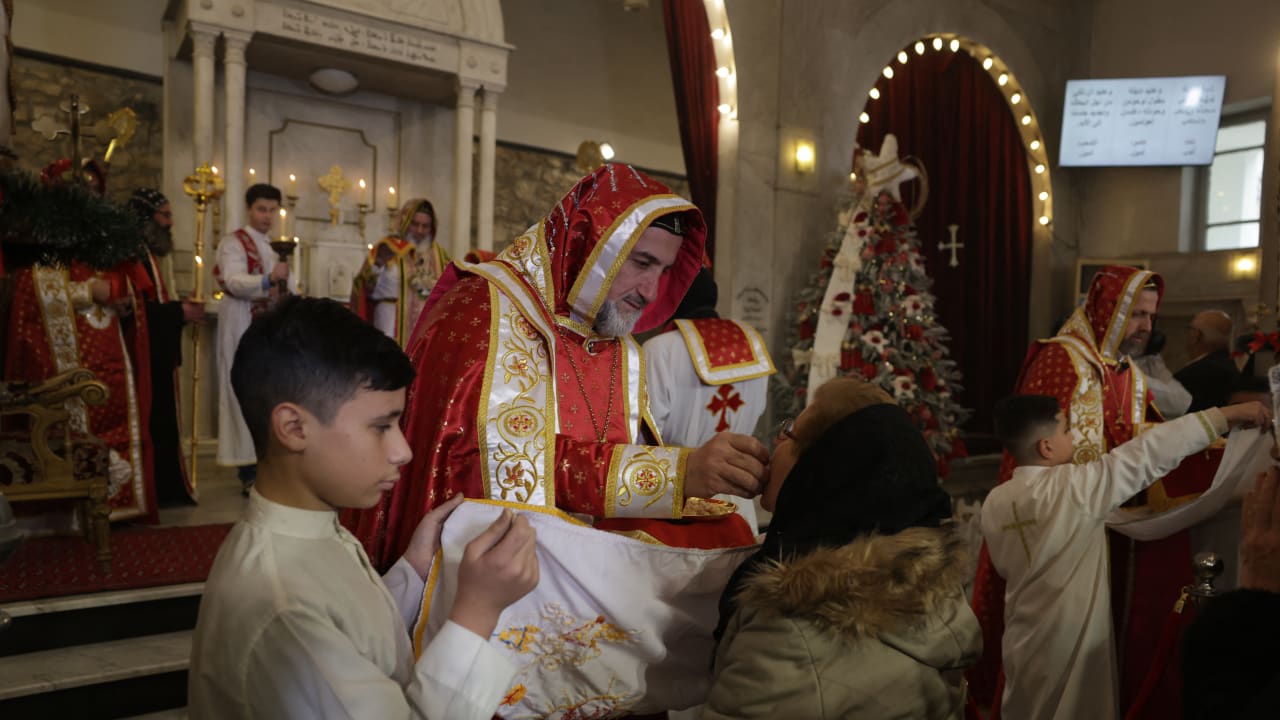 Clergymen lead Christmas celebrations at the St. George's Syriac Orthodox Church in the old city of Damascus.