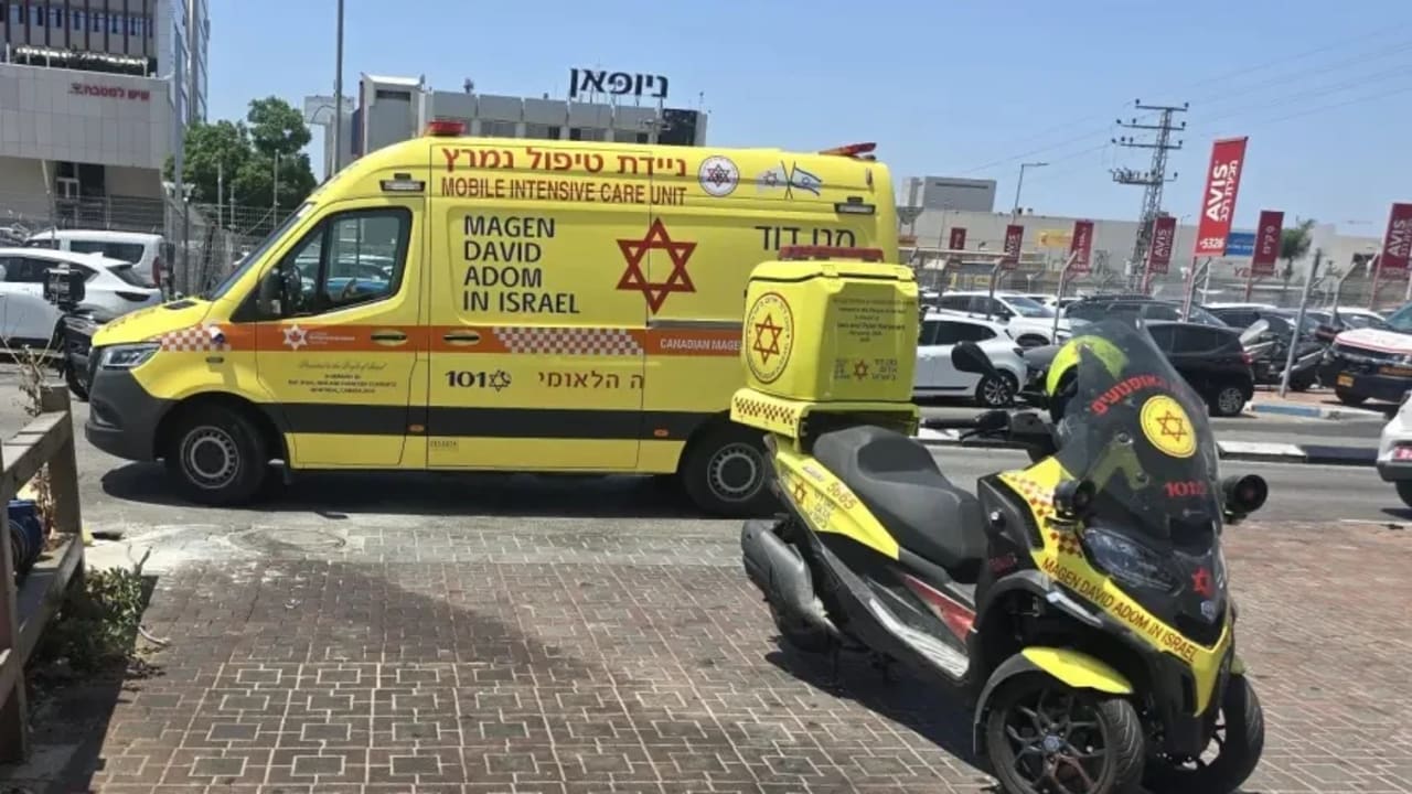 MDA vehicles outside of the scene where a well-known lawyer was murdered in a suspected assassination on August 4, 2026. 
