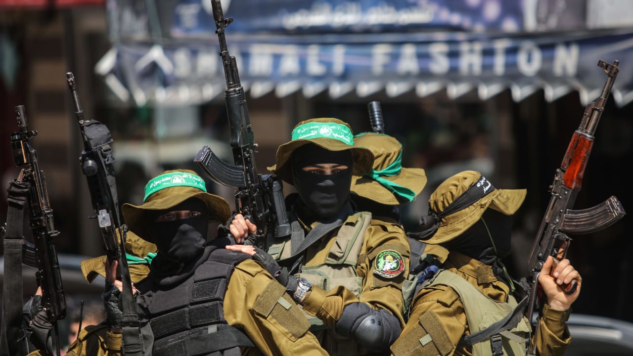 Masked gunmen from the Qassam brigade, the militia wing of Hamas, attend the funeral of Mazen Faqha in Gaza City, Saturday, March, 25, 2017. The former Palestinian prisoner whom Israel sent to Gaza after his release was found shot dead at the entrance of his house in Gaza City.