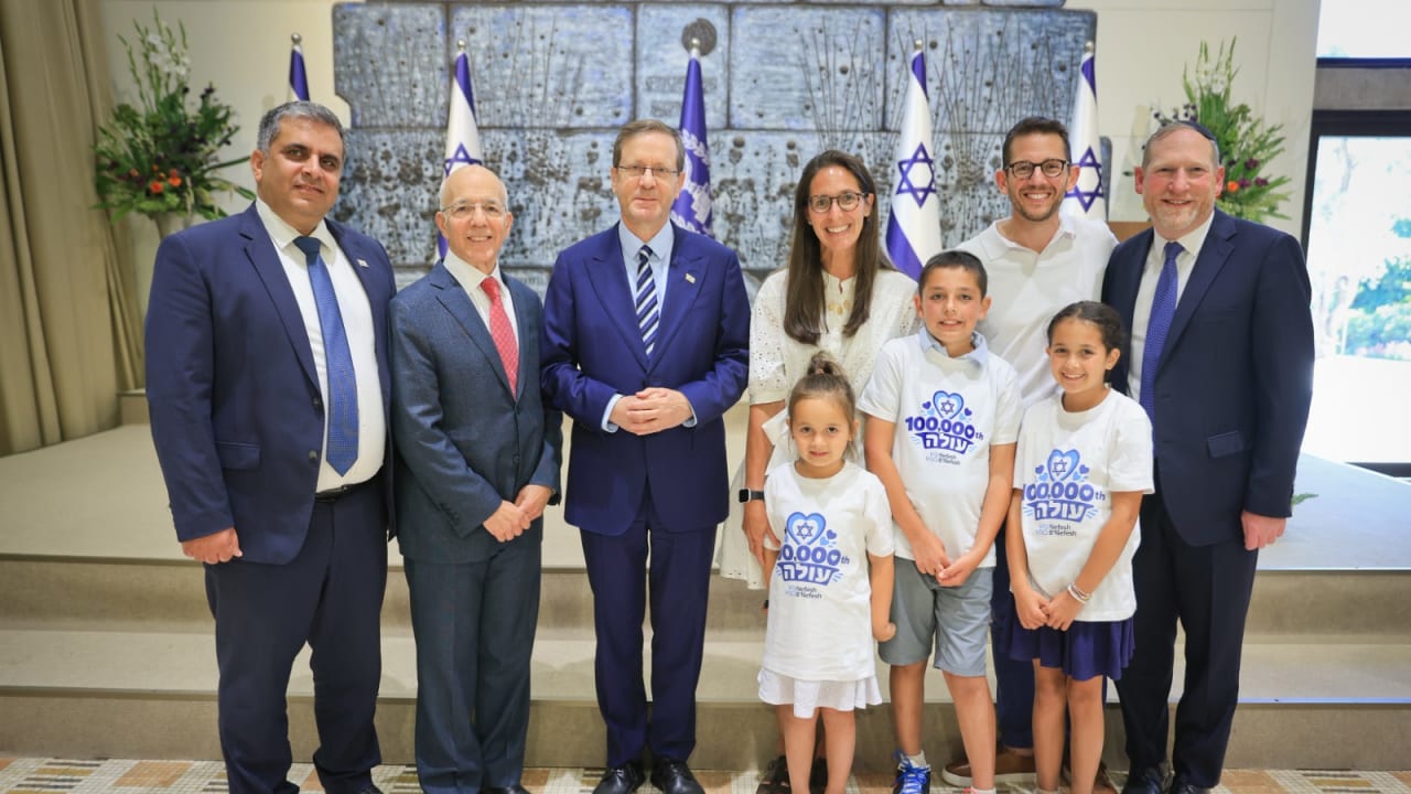 President Isaac Herzog, Aliyah and Integration Minister Ofir Sofer, Nefesh B'Nefesh founders Rabbi Yehoshua Fass and Tony Gelbart welcome the Douglas family in the President's Residence, Jerusalem, August 9, 2026.