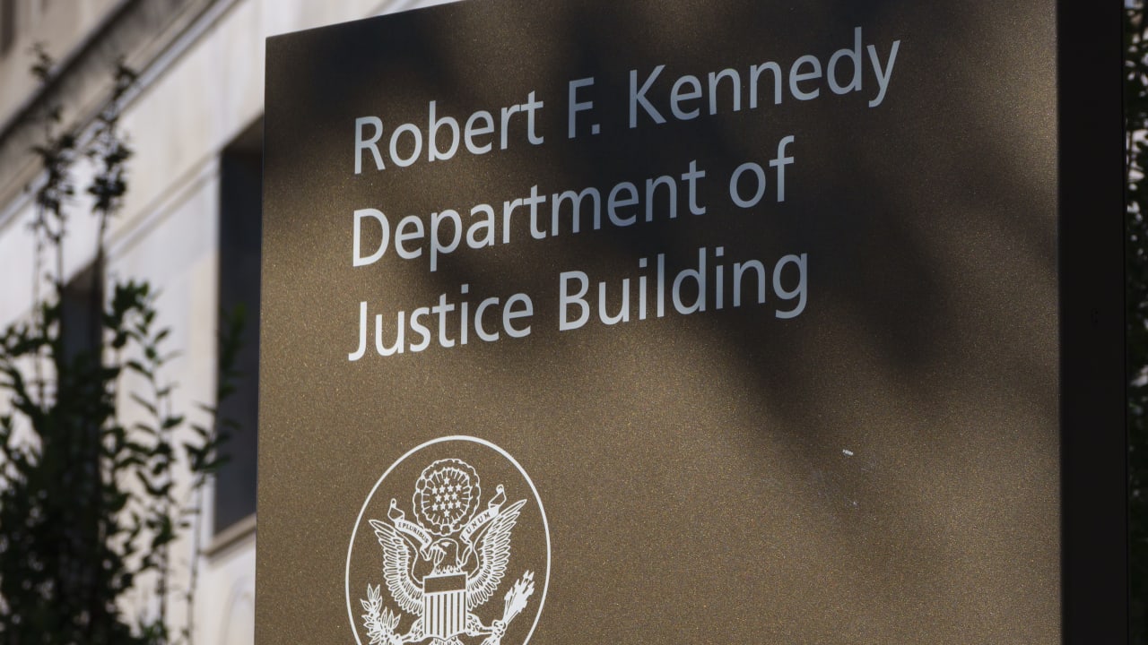 A sign is displayed at the Robert F. Kennedy Department of Justice Building, headquarters of the U.S. Department of Justice on August 8, 2026 in Washington, DC; illustrative