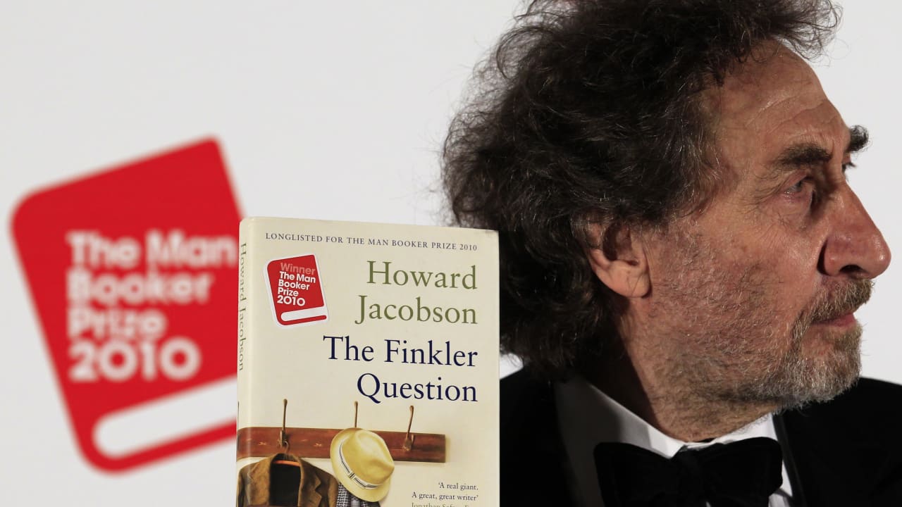 BRITISH AUTHOR Howard Jacobson poses with his book ‘The Finkler Question’ after winning the 2010 Man Booker Prize for Fiction, at London’s Guildhall Oct. 2010. 