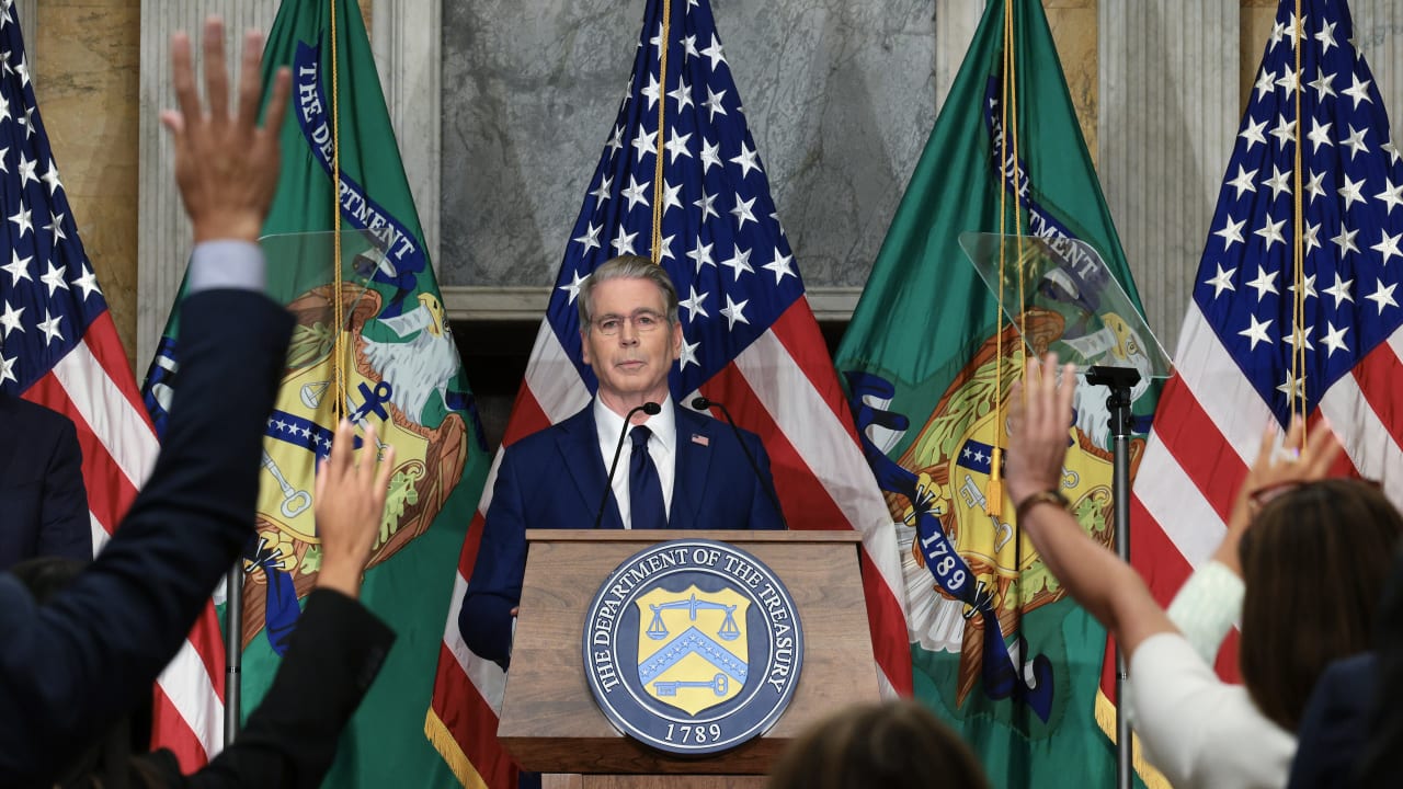 Reporters ask US Treasury Secretary Scott Bessent questions after he announced a new set of sanctions against Iran, describing them as "an economic D-Day", in the Cash Room at the Treasury Department on August 24, 2026 in Washington, DC.  