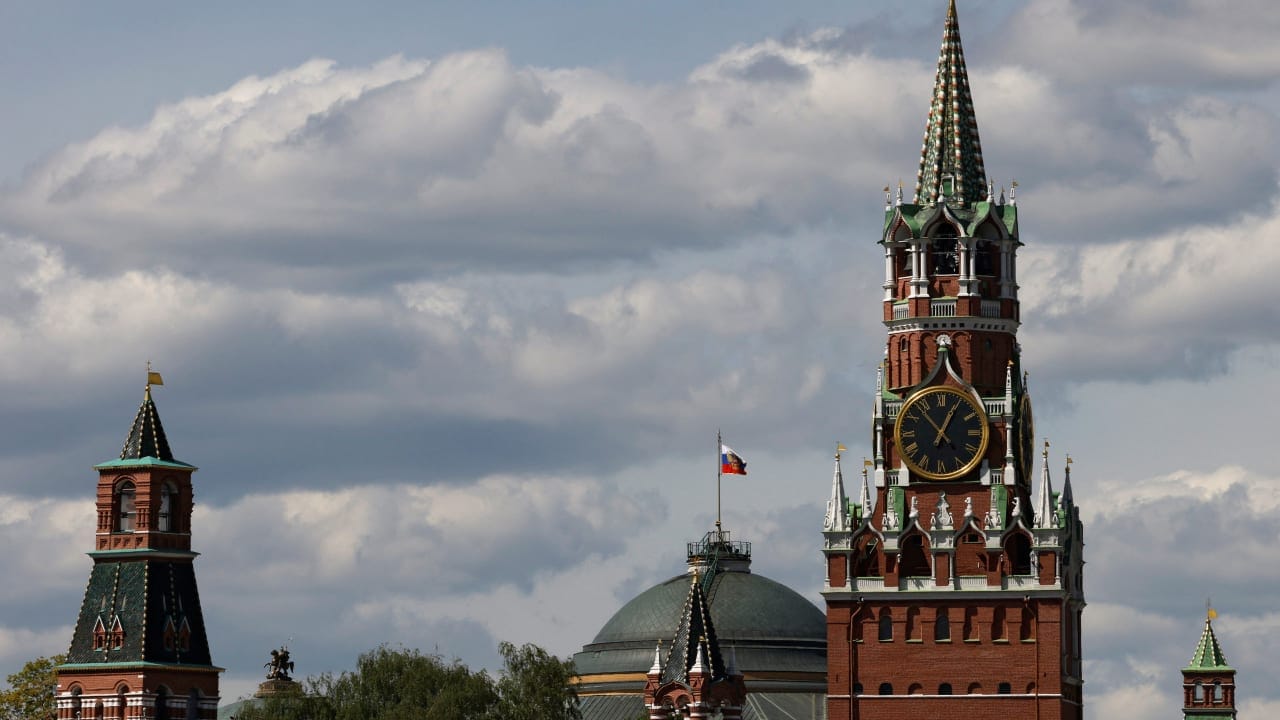 The Russian flag flies on the dome of the Kremlin Senate building behind Spasskaya Tower, in central Moscow, Russia, May 4, 2023.