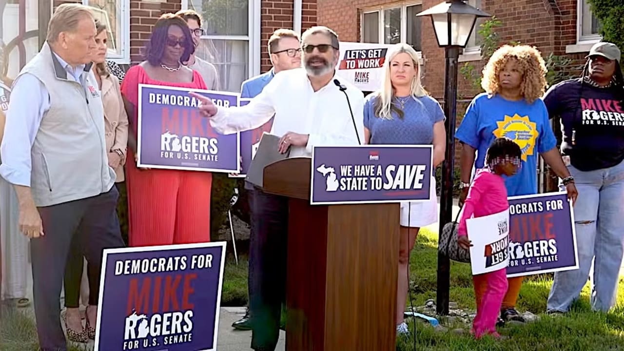 Republican US Senate candidate Mike Rogers, at left, looks on as Rabbi Asher Lopatin, the former director of Community Relations at the Jewish Federation of Greater Ann Arbor, speaks in support of his campaign in Detroit, Michigan, Aug. 20, 2026. 