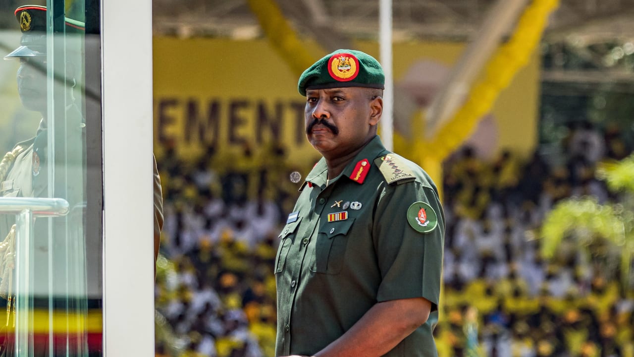 Muhoozi Kainerugaba, son of Yoweri Museveni and Uganda's Chief of Defence Forces, inspects a military parade from a vehicle during the inauguration ceremony of his father following his re-election as president at the Kololo Ceremonial Grounds in Kampala on May 12, 2026.