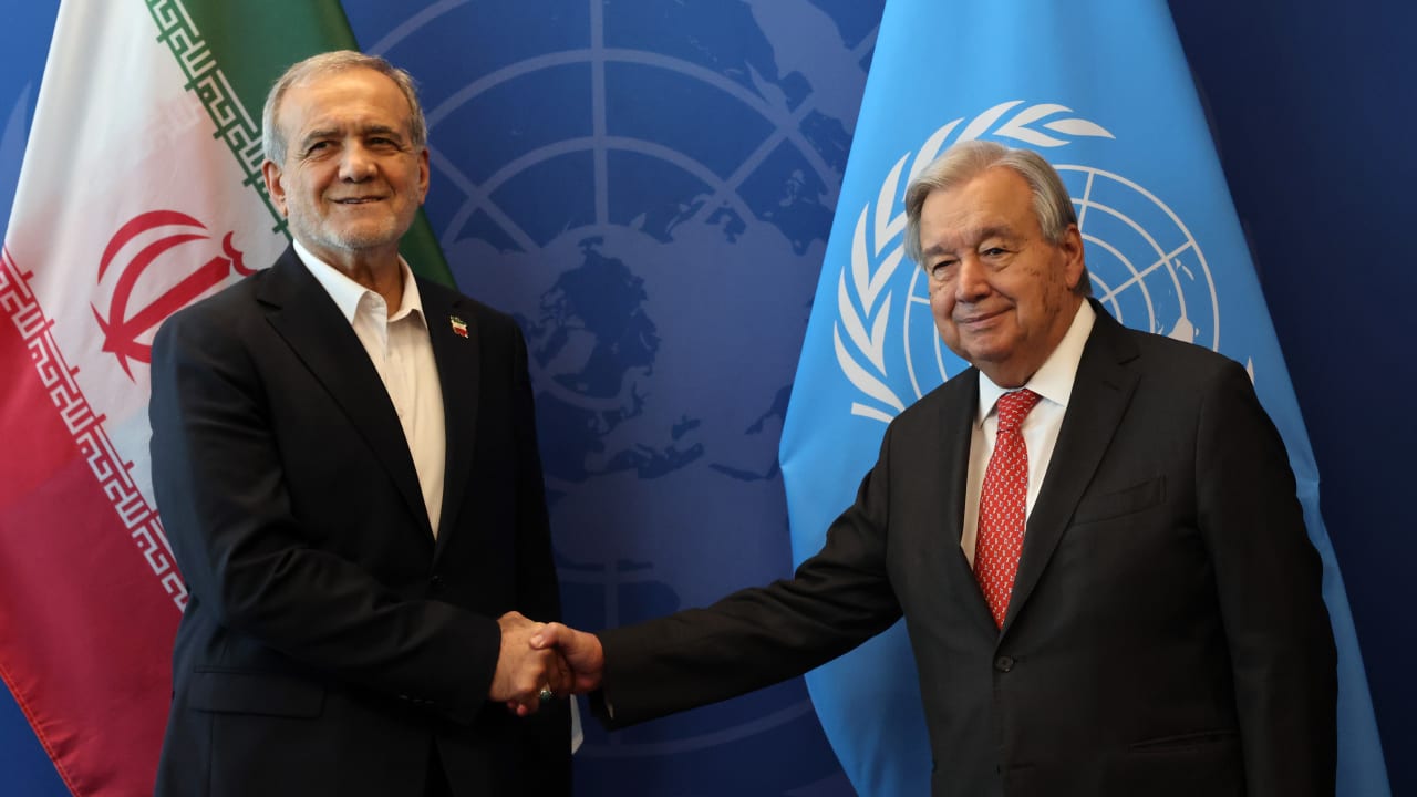 Iranian President Masoud Pezeshkian (L) shakes hands with the United Nations (UN) Secretary General Antonio Guterres during the UN's General Assembly.