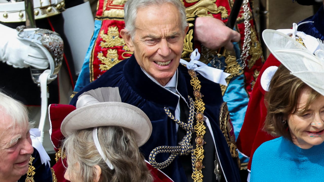 Britain's former prime minister Tony Blair (C) and his wife Cherie Blair (R) depart after attending the annual Order of the Garter service at St. George's Chapel in Windsor Castle, west of London, on June 15, 2026.