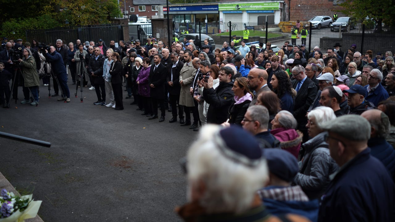 Members of the community gather for a vigil and one miniute silence at Heaton Park Hebrew Synagogue on October 09, 2025 in Manchester, England.