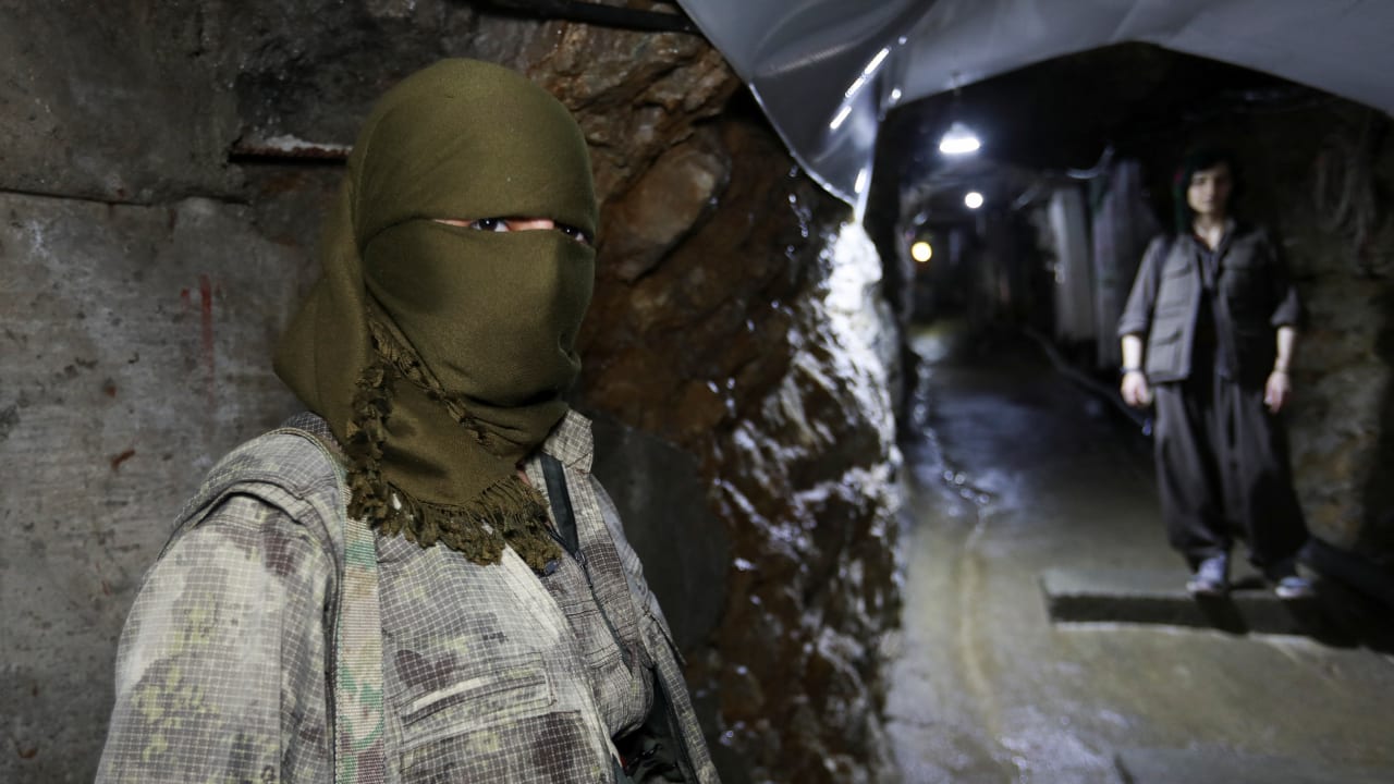 A member of the Kurdistan Free Life Party, known as PJAK, stands inside a tunnel at a site near the Iraqi border with Iran, on the outskirts of Penjwen, in Iraq’s autonomous Kurdistan region, Iraq, March 24, 2026. 
