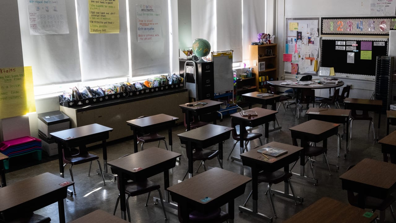 Unused desks are seen in an empty elementary school classroom during a period of Non-Traditional Instruction (NTI) at Hazelwood Elementary School on January 11, 2022 ; illustrative