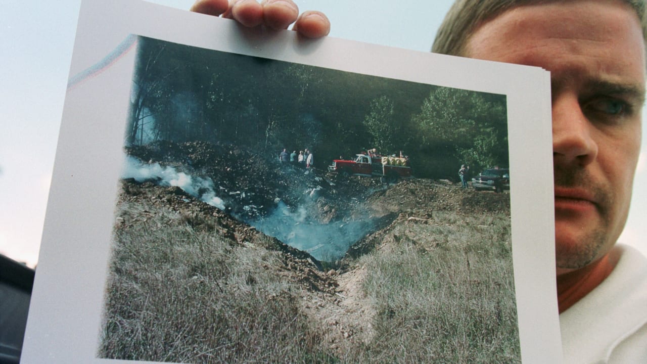 MARK STAHL of Somerset, Pennsylvania displays a photo he took early on September 11, 2001 after United Airlines Flight 93 crashed just outside of Shanskville.