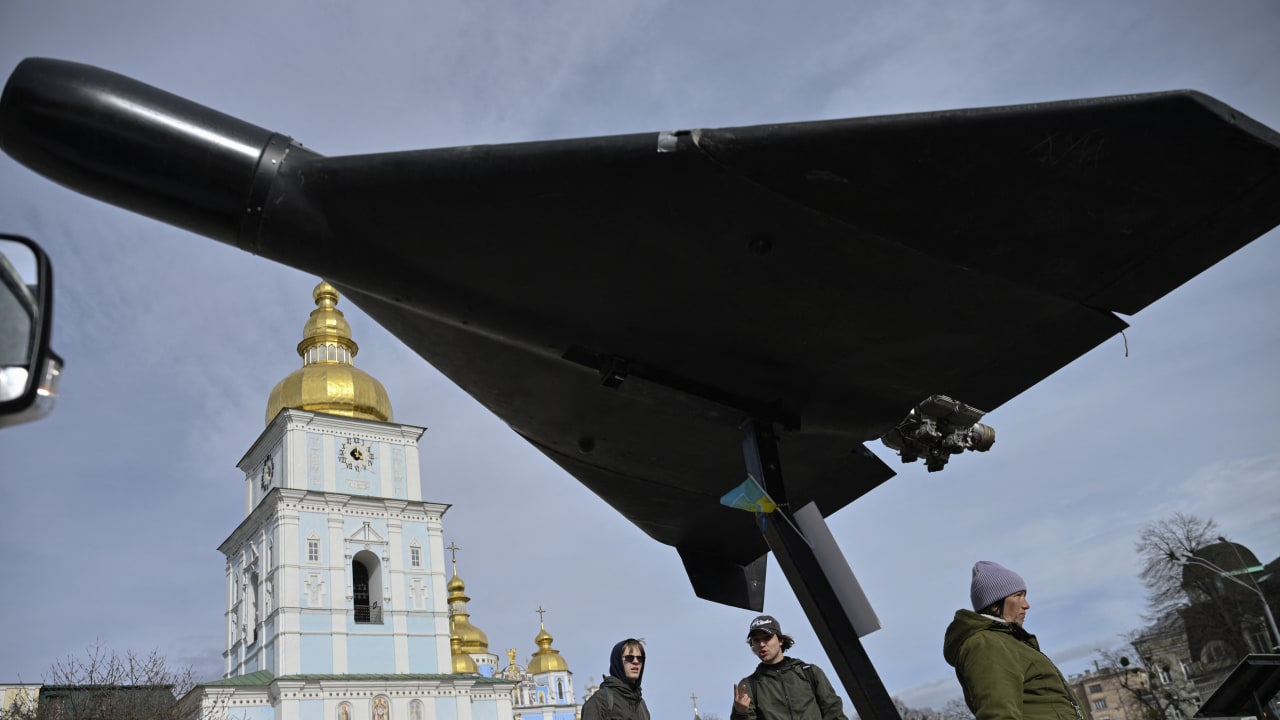 People look at an Iranian-designed HESA Shahed 136 (Geran-2) drone at an open-air exhibition of destroyed Russian military equipment on Mykhailivska Square in front of Saint Michael's Golden-Domed Cathedral, in Kyiv, on April 7, 2026.