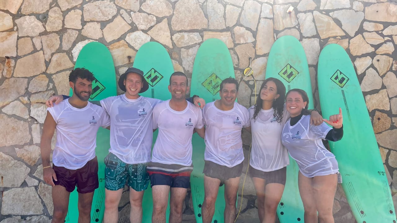 Diaspora Affairs Minister Amichai Chikli joins wounded IDF soldiers and veterans for a surfing session in Herzliya, September 2026.