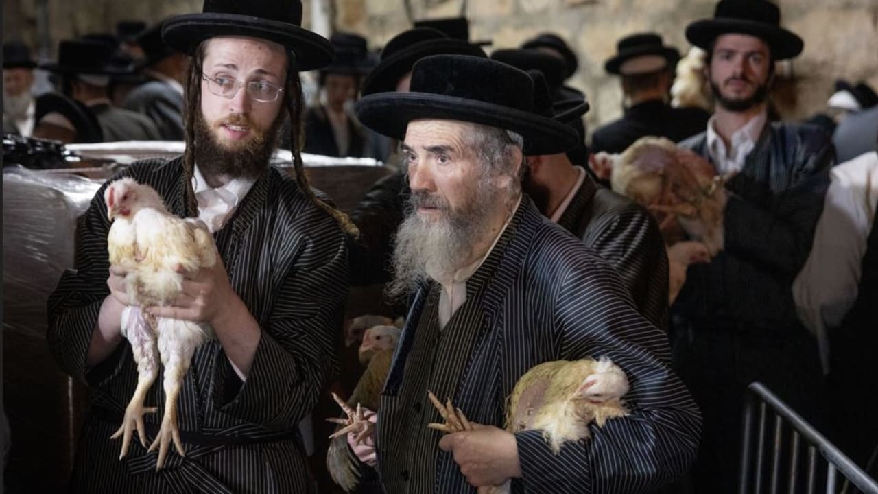Ultra-Orthodox men line up to partake in the kapparot tradition in Mea She’arim in 2025.