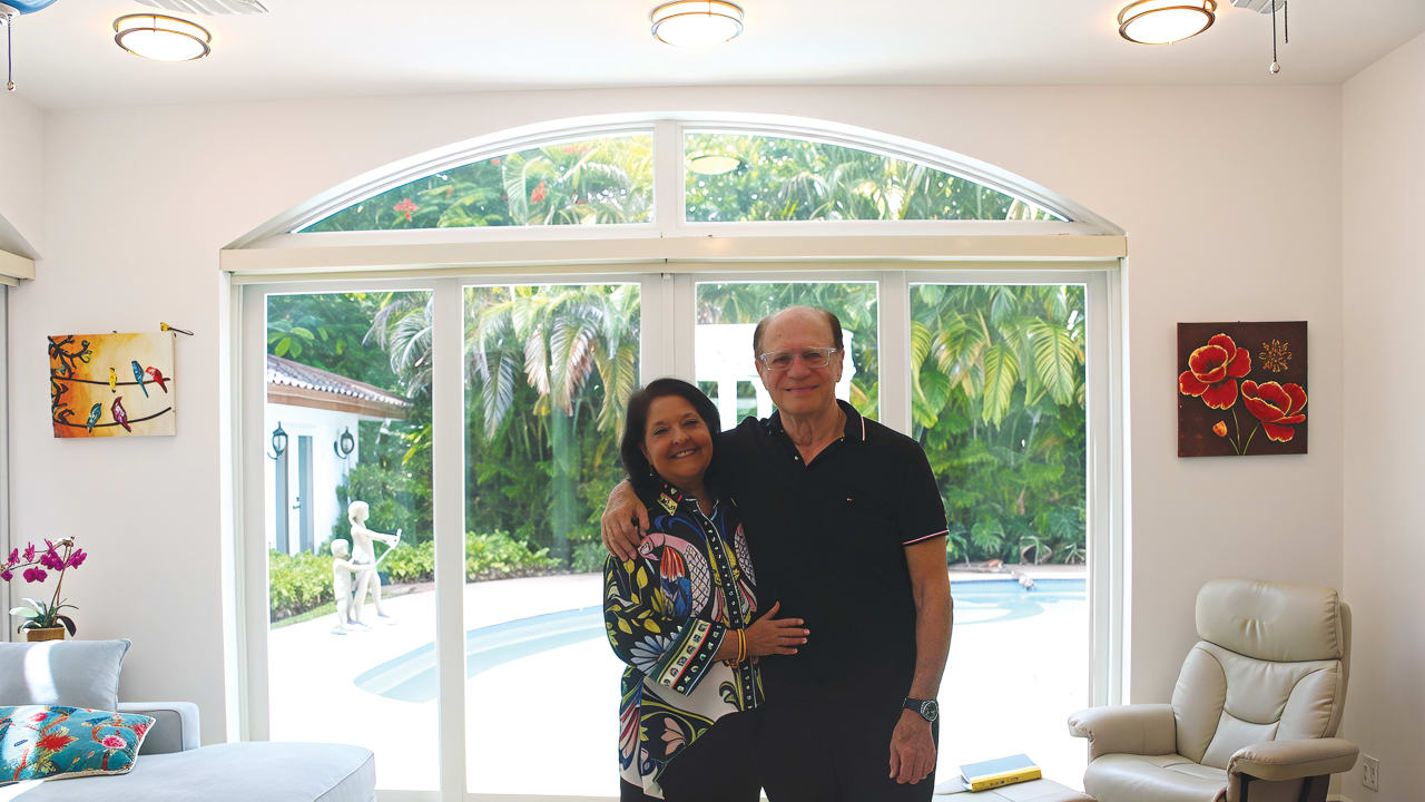 GENIE AND Michael Milgrom pose in their home in Miami.