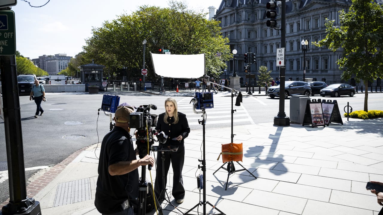 CNN Senior White House Report Betsy Klein during a television report on a street corner outside the White House grounds after earlier being denied entry, on September 19, 2026 in Washington, DC.
