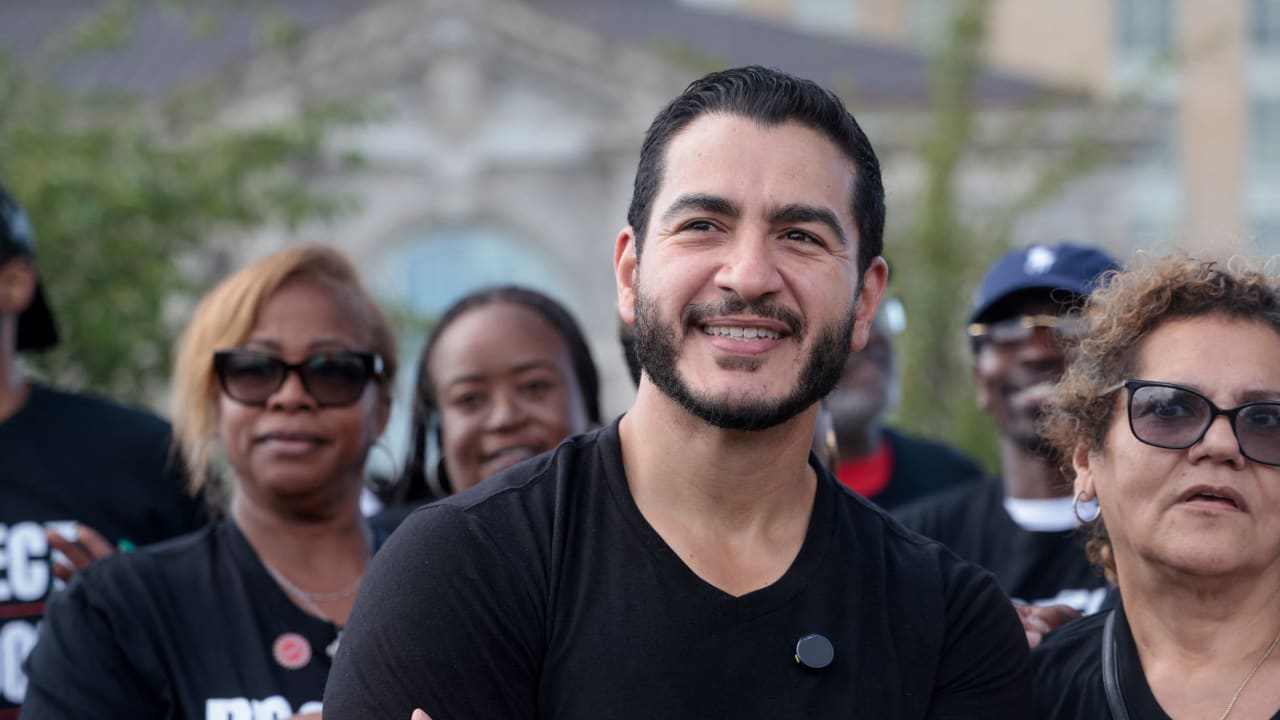 Democratic candidate for US Senate Abdul El-Sayed poses with union members from UAW Local 51 during the Labor Day Parade in Detroit, Michigan, US, September 7, 2026.