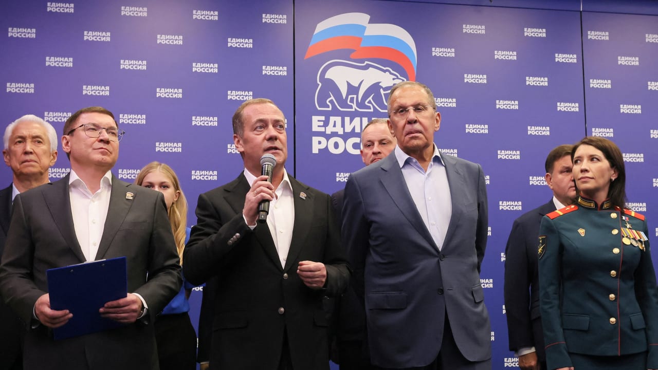 Senior members of Russia's ruling United Russia party, including Deputy Chairman of the Russian Security Council Dmitry Medvedev and Foreign Minister Sergei Lavrov, visit the party's headquarters following the announcement of preliminary results of a parliamentary election in Moscow, Russia.