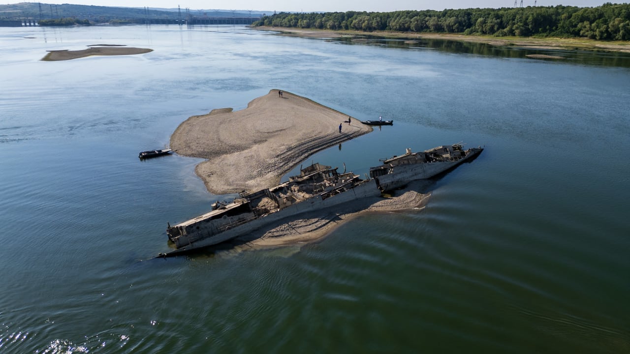 This aerial photograph shows the wreckage of a World War II German warship, one of dozens sunk by retreating Nazi forces in September 1944, emerging from the low waters of the Danube River near Prahovo, Serbia, on August 11, 2026.
