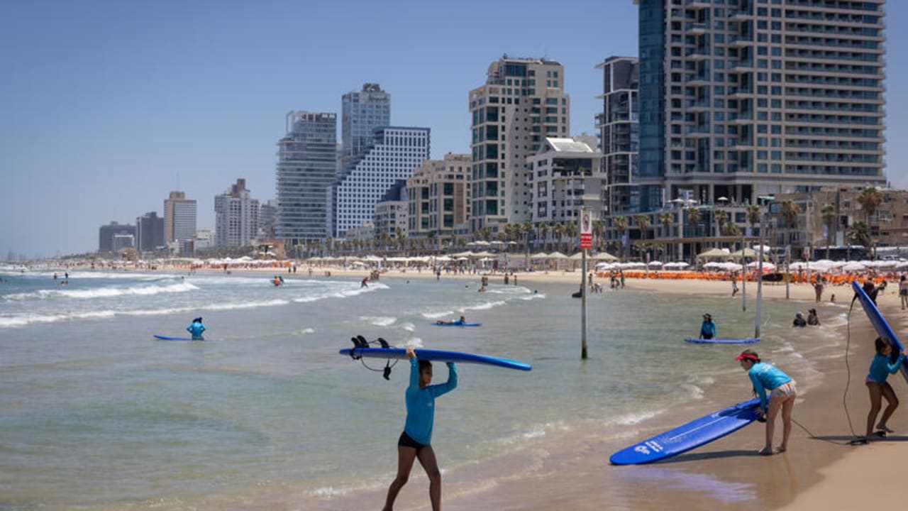 Beachgoers at the beach in Tel Aviv. July 09, 2026