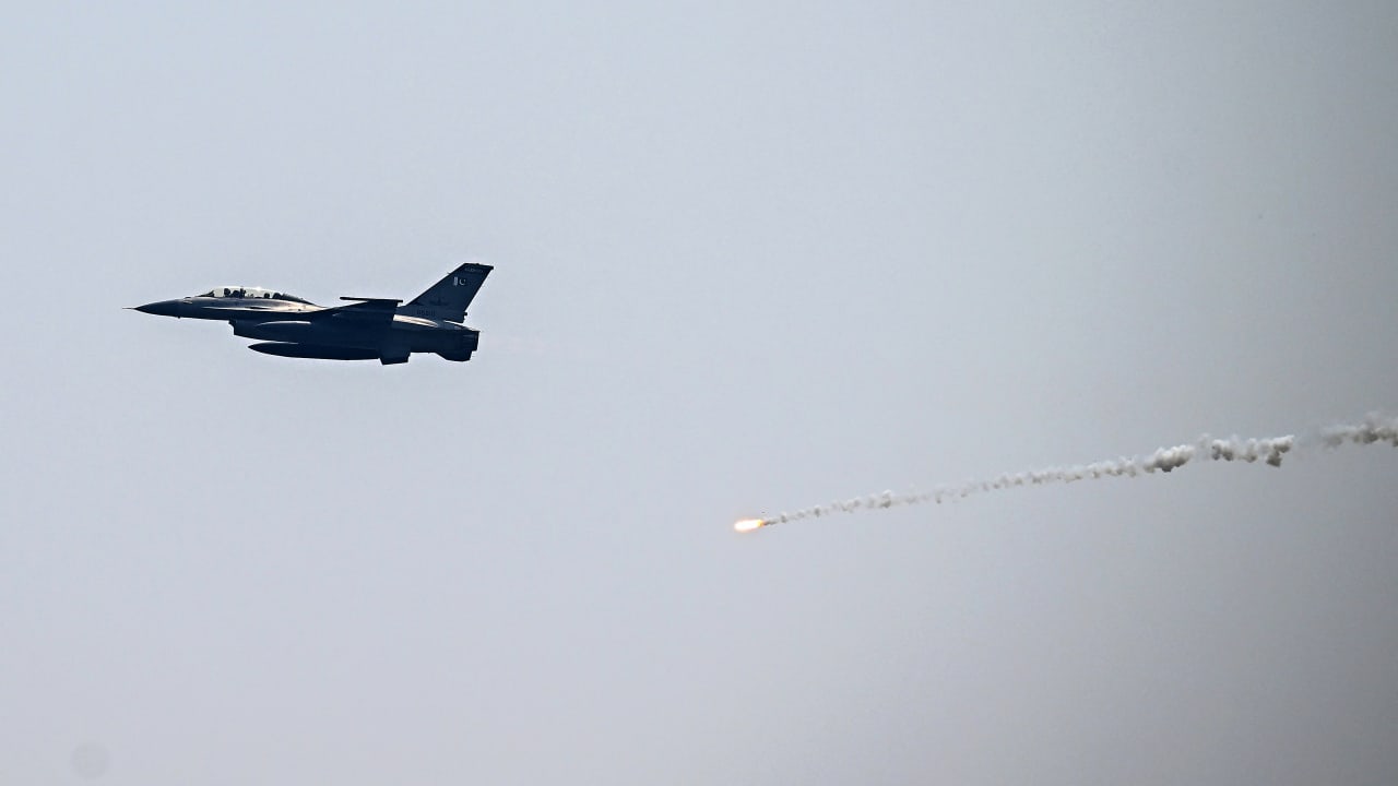A Pakistan Air Force fighter jet drops flares during a rehearsal in Islamabad on May 8, 2026 marking one year since the IndiaPakistan clashes that followed an attack in Indian-administered Kashmir. 